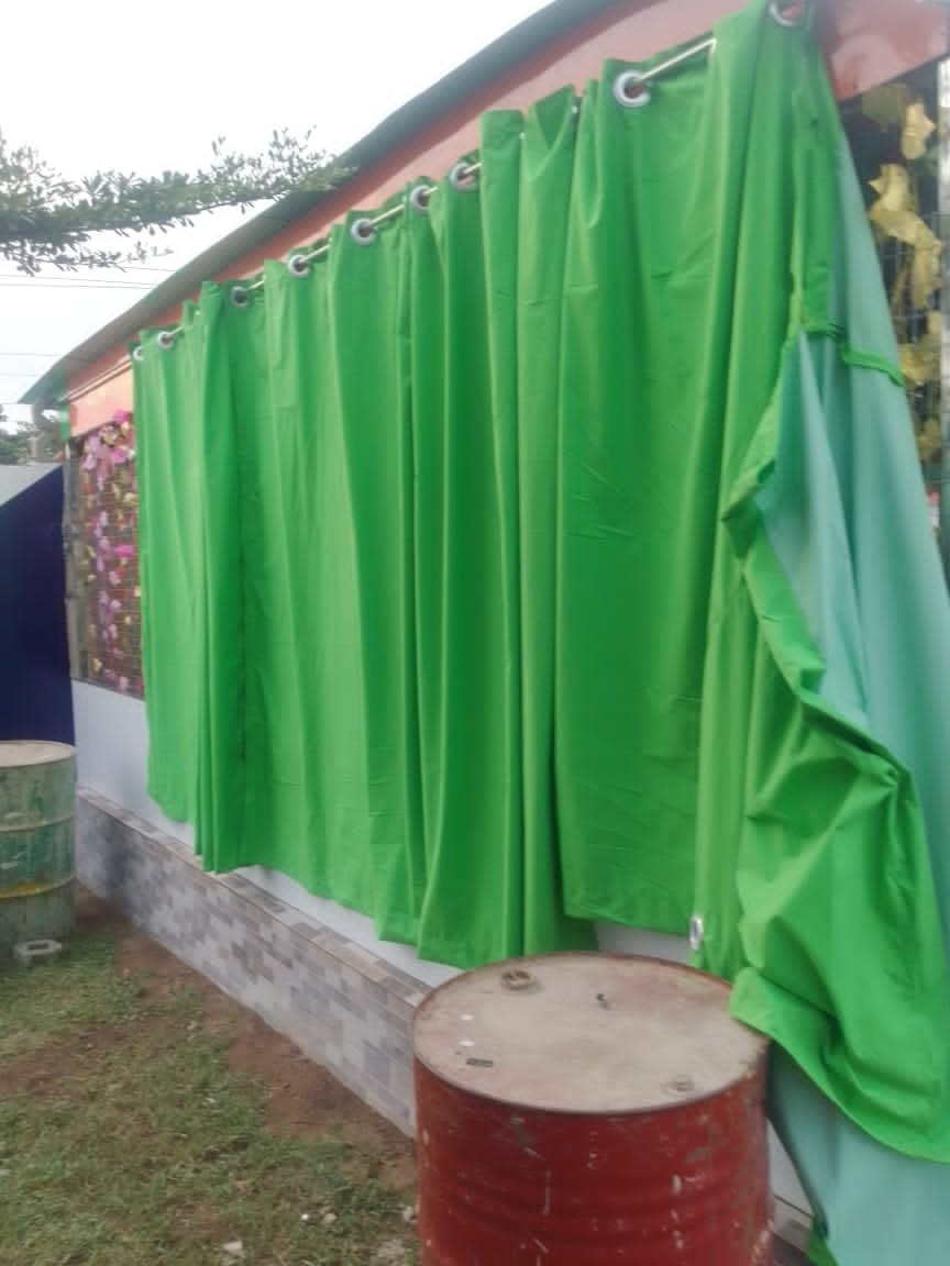 Green curtains installed in a finished room