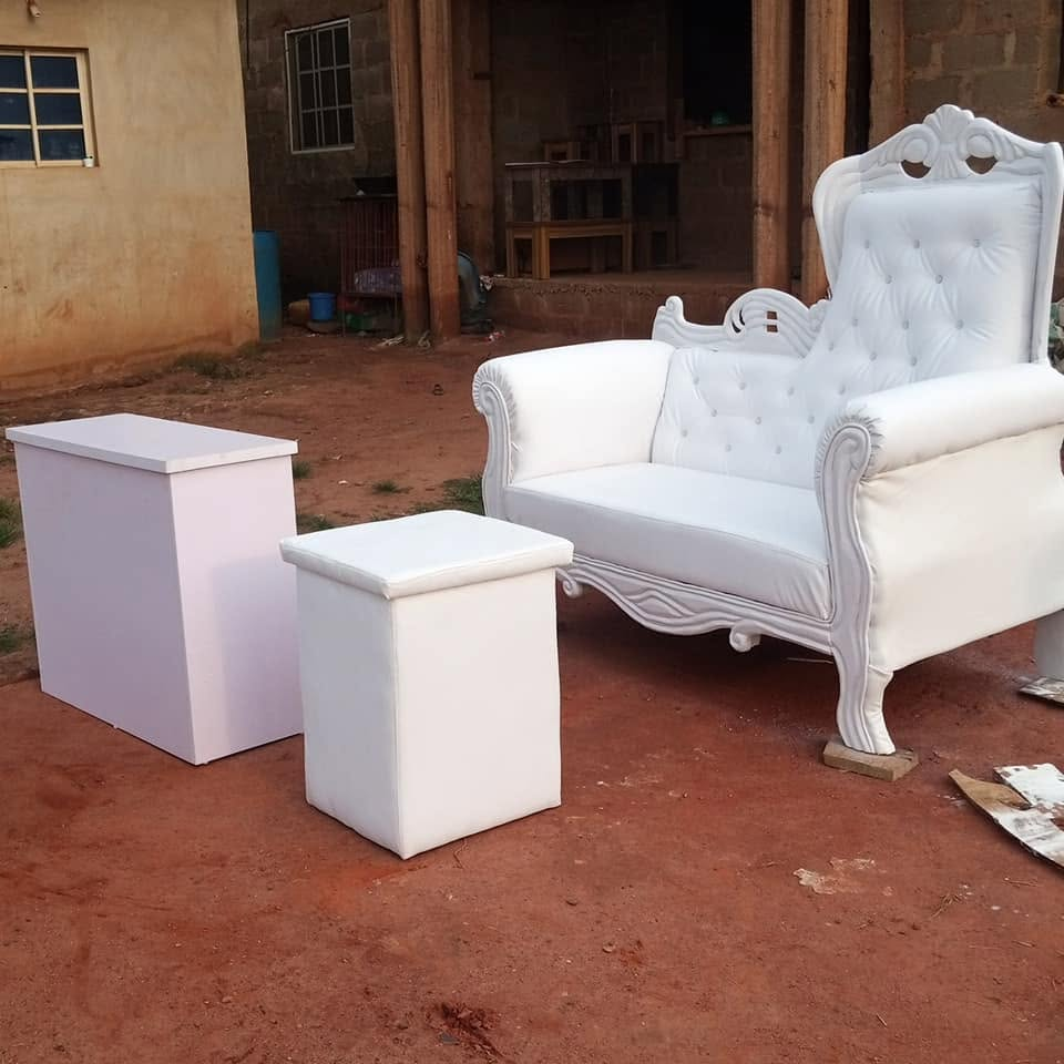 White carved button-tufted chair photographed with two matching white stands at the workshop